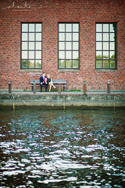 Brick building and water in a Seattle Engagement Session www.alantephotography.com